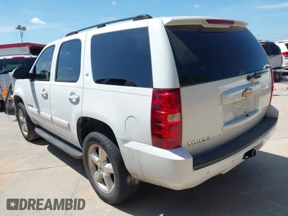 2007 Chevrolet Tahoe LS z VIN 1GNFC13007R310861, wystawiony jako IAAI lot #42621401 z przebiegiem 241 291 mil mil oraz . Historia ofert i sprzedaży dostępna na DreamBid. Obrazek 3.