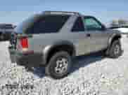 2001 Chevrolet Blazer LS z VIN 1GNCT18W71K130129, wystawiony jako Copart lot #85113764 z przebiegiem 65 992 mil mil oraz Czysty tytuł • Clean title. Historia ofert i sprzedaży dostępna na DreamBid. Obrazek 3.