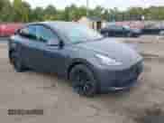 2022 Tesla Model Y Long Range z VIN 7SAYGDEE9NA018029, wystawiony jako IAAI lot #43211378 z przebiegiem 59 492 mil mil oraz . Historia ofert i sprzedaży dostępna na DreamBid. Obrazek 1.