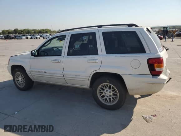 2002 Jeep Grand Cherokee Limited with VIN 1J4GX58N12C282300, listed as a Copart auction lot 74939754 with 166,018 mi miles and Salvage title. Bid and sale history available at DreamBid. Image 2.
