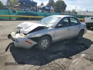 2001 Saturn SL with VIN 1G8ZK52721Z350956, listed as a Copart auction lot 84257715 with 242,623 mi miles and Non repairable. Bid and sale history available at DreamBid. Image 1.