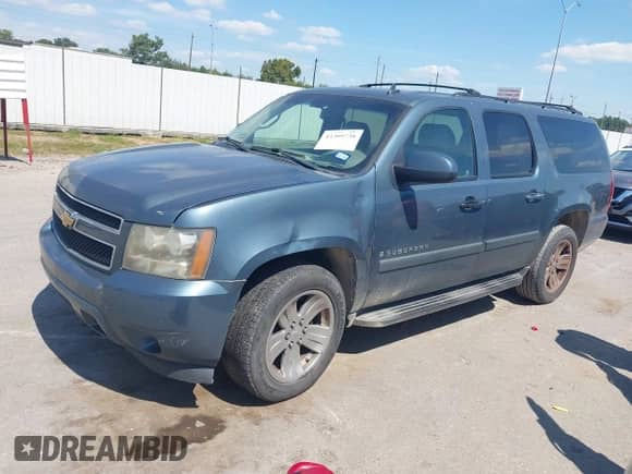 2009 Chevrolet Suburban 1LT z VIN 1GNFC26019J107903, wystawiony jako IAAI lot #43309738 z przebiegiem 228 930 mil mil oraz . Historia ofert i sprzedaży dostępna na DreamBid. Obrazek 17.