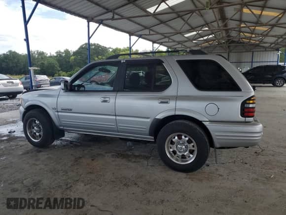 2000 Honda Passport LX with VIN 4S6CK58W3Y4401322, listed as a Copart auction lot 70466595 with 189,630 mi miles and Salvage title. Bid and sale history available at DreamBid. Image 2.
