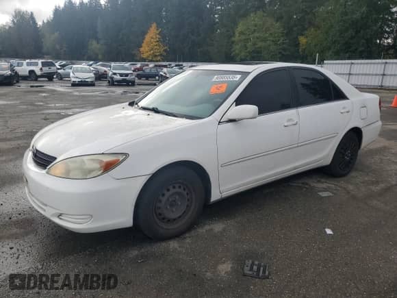 2004 Toyota Camry LE z VIN JTDBE32K340268167, wystawiony jako Copart lot #90885535 z przebiegiem 159 808 mil mil oraz Czysty tytuł • Clean title. Historia ofert i sprzedaży dostępna na DreamBid. Obrazek 1.