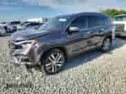 2018 Honda Pilot Touring z VIN 5FNYF5H92JB013871, wystawiony jako Copart lot #80849125 z przebiegiem 77 905 mil mil oraz Nie do naprawy • Non repairable. Historia ofert i sprzedaży dostępna na DreamBid. Obrazek 1.