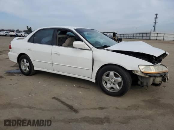 1999 Honda Accord LX with VIN 1HGCG1648XA028305, listed as a Copart auction lot 87960635 with 448,507 mi miles and Salvage title. Bid and sale history available at DreamBid. Image 4.