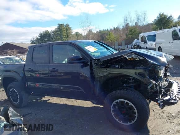 2024 Toyota Tacoma SR5 with VIN 3TMLB5JN0RM008463, listed as a IAAI auction lot 40979020 with 4,710 mi miles and . Bid and sale history available at DreamBid. Image 14.