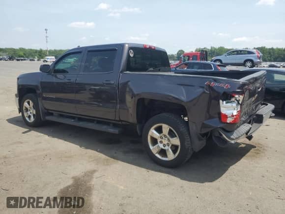 2015 Chevrolet Silverado 1500 LT with VIN 3GCUKREH4FG379779, listed as a Copart auction lot 61352135 with 165,378 mi miles and Salvage title. Bid and sale history available at DreamBid. Image 2.
