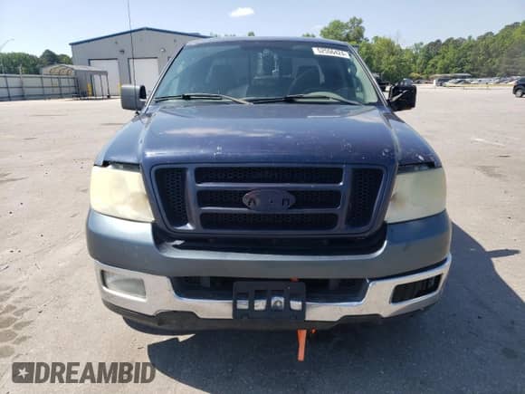 2005 Ford F-150 STX with VIN 1FTRX12W15NB13203, listed as a Copart auction lot 52556424 with 211,823 mi miles and Salvage title. Bid and sale history available at DreamBid. Image 5.