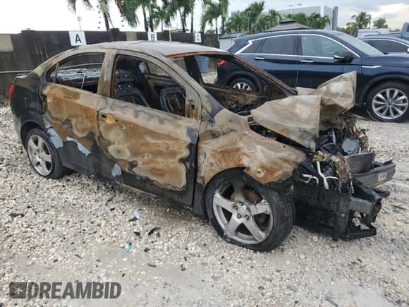 2013 Chevrolet Sonic LTZ с VIN 1G1JE5SHXD4169990, выставлен на аукционе Copart как лот 80101435 с пробегом Не указан миль и На запчасти • Non repairable. История ставок и продаж доступна на DreamBid. Изображение 4.