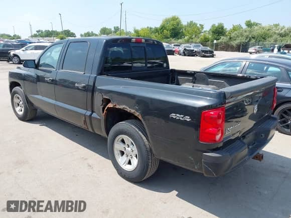 2008 Dodge Dakota SLT with VIN 1D7HW48K78S593988, listed as a IAAI auction lot 42825788 with 216,208 mi miles and . Bid and sale history available at DreamBid. Image 3.