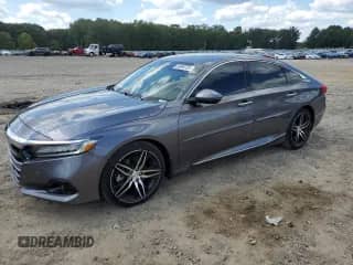 2021 Honda Accord Touring с VIN 1HGCV2F90MA022372, выставлен на аукционе Copart как лот 69996705 с пробегом 70 742 миль миль и Списание • Salvage title. История ставок и продаж доступна на DreamBid. Изображение 1.