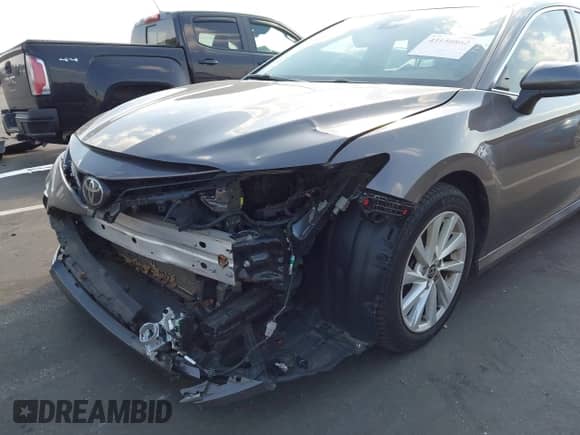2021 Toyota Camry LE z VIN 4T1C11AK7MU593799, wystawiony jako IAAI lot #43150862 z przebiegiem 86 619 mil mil oraz . Historia ofert i sprzedaży dostępna na DreamBid. Obrazek 6.