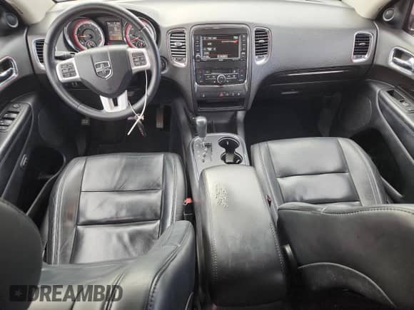 2013 Dodge Durango Crew with VIN 1C4RDJDG5DC509465, listed as a Copart auction lot 87090895 with 146,985 mi miles and Salvage title. Bid and sale history available at DreamBid. Image 8.