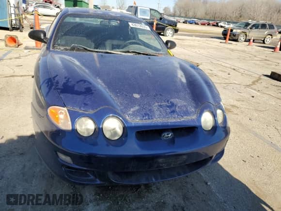 2001 Hyundai Tiburon с VIN KMHJG25F11U261457, выставлен на аукционе Copart как лот 43012635 с пробегом 165 625 миль миль и Списание • Salvage title. История ставок и продаж доступна на DreamBid. Изображение 5.