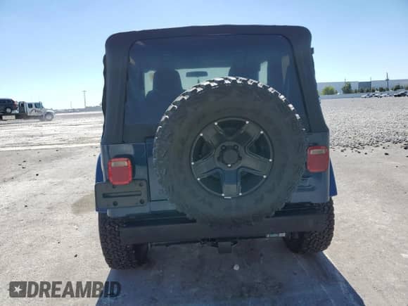 2003 Jeep Wrangler X z VIN 1J4FA39S73P355010, wystawiony jako Copart lot #86589105 z przebiegiem 126 492 mil mil oraz Szkoda całkowita • Salvage title. Historia ofert i sprzedaży dostępna na DreamBid. Obrazek 6.
