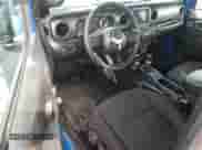 2023 Jeep Wrangler Sport S with VIN 1C4GJXAN4PW636667, listed as a Copart auction lot 64936505 with 33,192 mi miles and Salvage title. Bid and sale history available at DreamBid. Image 8.