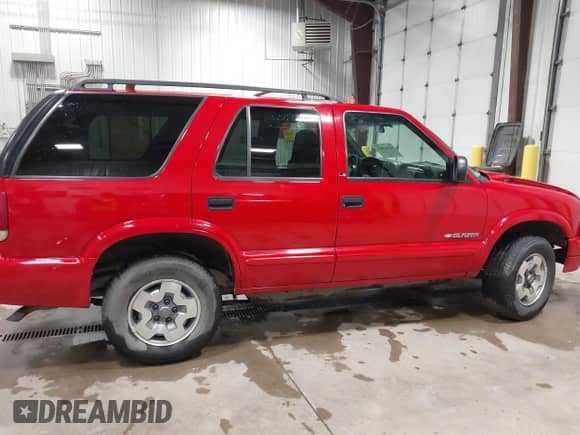 2002 Chevrolet Blazer LS z VIN 1GNDT13W02K213365, wystawiony jako IAAI lot #42561803 z przebiegiem 112 894 mil mil oraz . Historia ofert i sprzedaży dostępna na DreamBid. Obrazek 13.