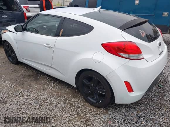 2014 Hyundai Veloster with VIN KMHTC6AD7EU217470, listed as a IAAI auction lot 41286296 with 150,034 mi miles and . Bid and sale history available at DreamBid. Image 3.