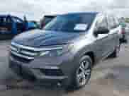 2016 Honda Pilot EX-L with VIN 5FNYF5H57GB050100, listed as a IAAI auction lot 43262741 with 118,485 mi miles and . Bid and sale history available at DreamBid. Image 2.