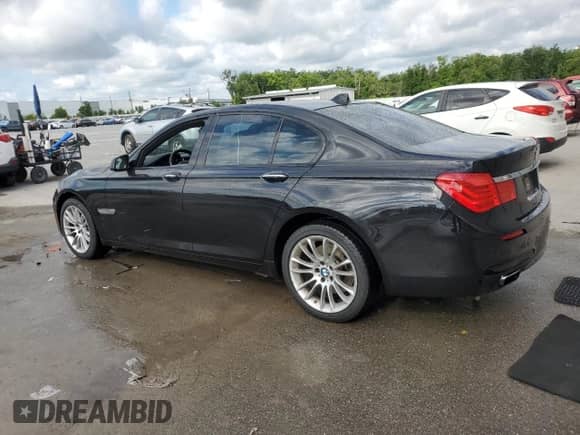 2011 BMW 7 Series 740i с VIN WBAKA4C52BC612977, выставлен на аукционе Copart как лот 52582575 с пробегом 157 813 миль миль и Списание • Salvage title. История ставок и продаж доступна на DreamBid. Изображение 2.