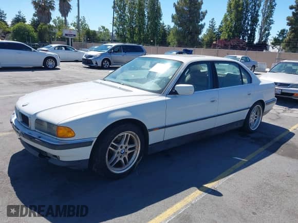 1998 BMW 7 Series 740iL with VIN WBAGJ8328WDM15945, listed as a IAAI auction lot 42809205 with 239,449 mi miles and . Bid and sale history available at DreamBid. Image 2.