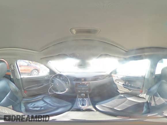 2012 Chevrolet Impala LTZ with VIN 2G1WC5E30C1209290, listed as a Copart auction lot 70700785 with 152,894 mi miles and Salvage title. Bid and sale history available at DreamBid. Image 14.