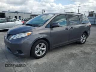 2015 Toyota Sienna LE with VIN 5TDKK3DC8FS629214, listed as a Copart auction lot 82405195 with 131,535 mi miles and Salvage title. Bid and sale history available at DreamBid. Image 1.