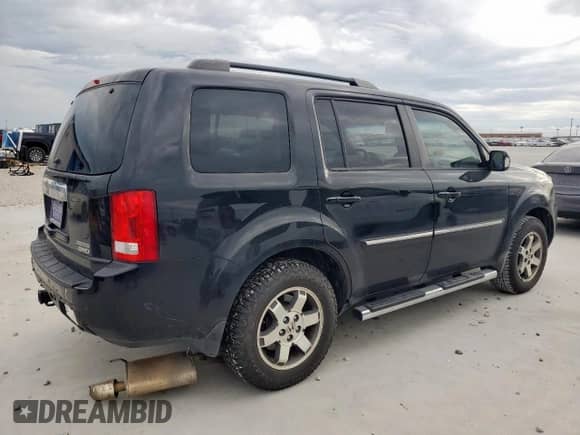2009 Honda Pilot Touring with VIN 5FNYF48809B035719, listed as a Copart auction lot 63201775 with 202,385 mi miles and Salvage title. Bid and sale history available at DreamBid. Image 3.