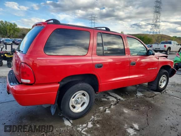 1999 Dodge Durango with VIN 1B4HS28Y8XF665252, listed as a Copart auction lot 84897495 with 173,078 mi miles and Salvage title. Bid and sale history available at DreamBid. Image 3.