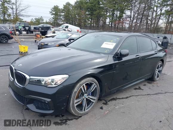 2019 BMW 7 Series 740i with VIN WBA7E2C57KB217973, listed as a IAAI auction lot 39064321 with 54,818 mi miles and . Bid and sale history available at DreamBid. Image 17.