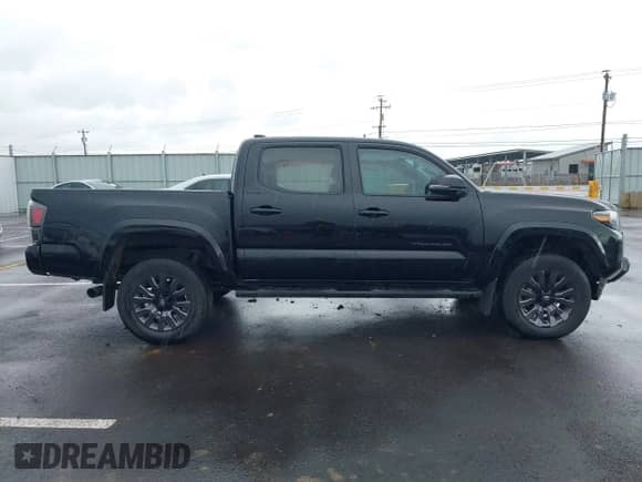 2022 Toyota Tacoma Limited with VIN 3TMGZ5AN4NM463887, listed as a IAAI auction lot 41592060 with 61,026 mi miles and . Bid and sale history available at DreamBid. Image 13.