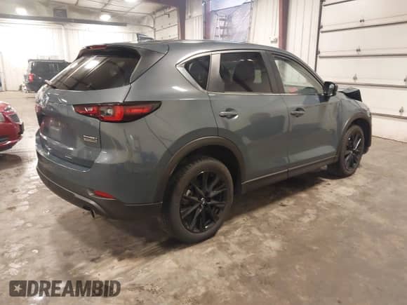 2023 Mazda CX-5 S Carbon Edition z VIN JM3KFBCM1P0238345, wystawiony jako IAAI lot #42799769 z przebiegiem 53 614 mil mil oraz . Historia ofert i sprzedaży dostępna na DreamBid. Obrazek 4.