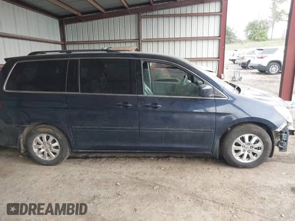 2008 Honda Odyssey EX-L with VIN 5FNRL38678B085411, listed as a IAAI auction lot 43015457 with 206,565 mi miles and . Bid and sale history available at DreamBid. Image 14.