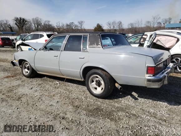 1982 Chevrolet Malibu Classic с VIN 1G1AW69J4CR214063, выставлен на аукционе Copart как лот 45906495 с пробегом Не указан миль и Списание • Salvage title. История ставок и продаж доступна на DreamBid. Изображение 2.