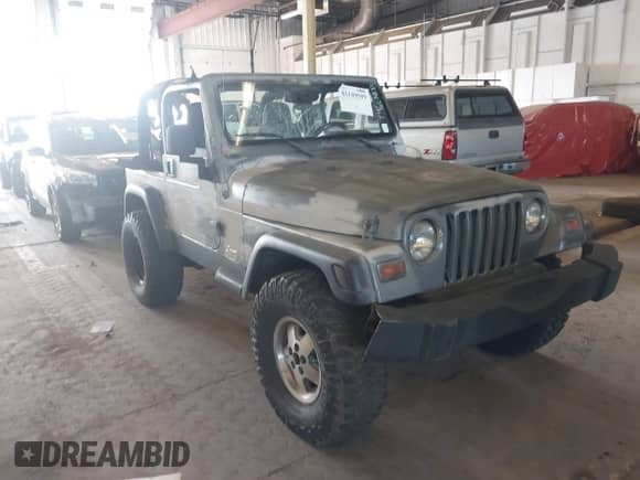 2005 Jeep Wrangler SE z VIN 1J4FA29115P314084, wystawiony jako IAAI lot #42149589 z przebiegiem 138 206 mil mil oraz . Historia ofert i sprzedaży dostępna na DreamBid. Obrazek 1.