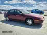 2002 Saturn SL with VIN 1G8ZG52882Z192053, listed as a Copart auction lot 68711695 with 309,633 mi miles and Salvage title. Bid and sale history available at DreamBid. Image 4.