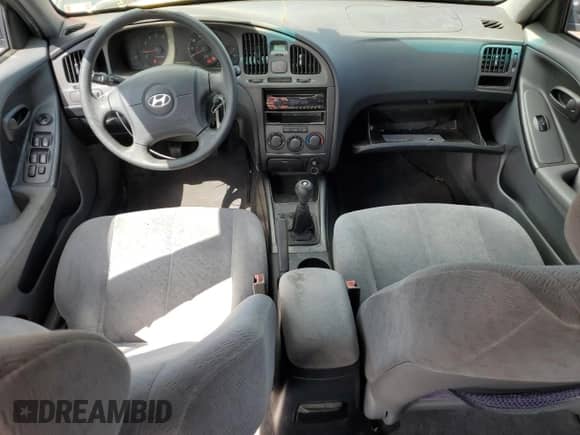 2005 Hyundai Elantra GLS z VIN KMHDN46D45U021031, wystawiony jako Copart lot #70877694 z przebiegiem 184 824 mil mil oraz Szkoda całkowita • Salvage title. Historia ofert i sprzedaży dostępna na DreamBid. Obrazek 8.