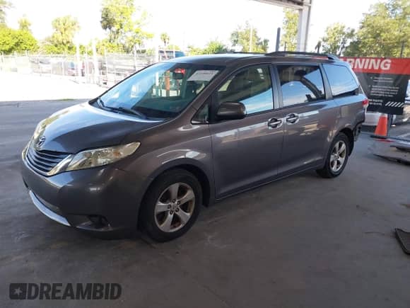 2012 Toyota Sienna LE AAS with VIN 5TDKK3DC6CS193748, listed as a IAAI auction lot 43190621 with 197,152 mi miles and . Bid and sale history available at DreamBid. Image 2.