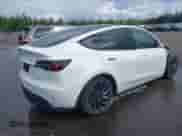 2022 Tesla Model Y Performance with VIN 7SAYGDEF7NF540878, listed as a IAAI auction lot 43102241 with 48,998 mi miles and . Bid and sale history available at DreamBid. Image 4.