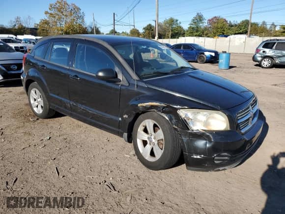 2010 Dodge Caliber SXT with VIN 1B3CB4HA9AD635046, listed as a Copart auction lot 82397075 with 190,652 mi miles and Salvage title. Bid and sale history available at DreamBid. Image 4.