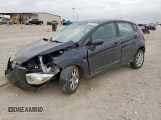 2011 Ford Fiesta SE with VIN 3FADP4EJ4BM142699, listed as a Copart auction lot 83821305 with 164,004 mi miles and Salvage title. Bid and sale history available at DreamBid. Image 1.
