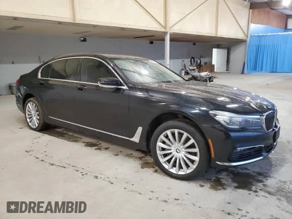 2017 BMW 7 Series 740i xDrive with VIN WBA7E4C53HGU99097, listed as a Copart auction lot 43945695 with 117,790 mi miles and Salvage title. Bid and sale history available at DreamBid. Image 4.