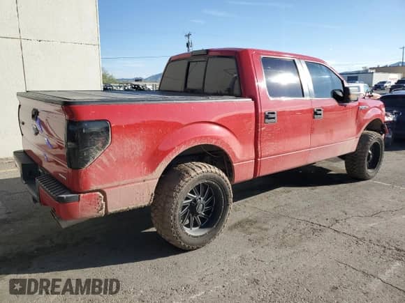 2012 Ford F-150 Lariat with VIN 1FTFW1CF5CKD31938, listed as a Copart auction lot 82513685 with 213,664 mi miles and Salvage title. Bid and sale history available at DreamBid. Image 3.