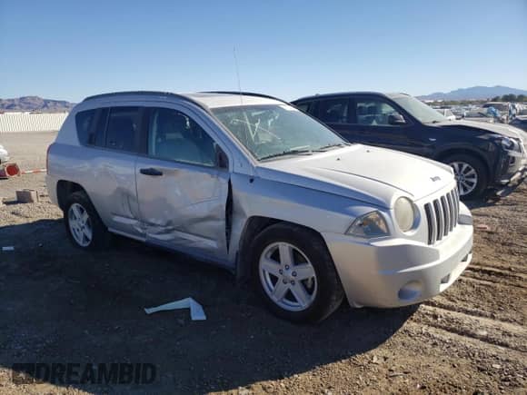 2007 Jeep Compass Sport with VIN 1J8FF47W47D136671, listed as a Copart auction lot 69504735 with Not provided miles and Salvage title. Bid and sale history available at DreamBid. Image 4.