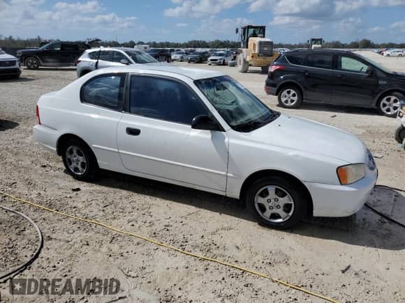 2002 Hyundai Accent GS z VIN KMHCG35C82U230535, wystawiony jako Copart lot #77709454 z przebiegiem 116 200 mil mil oraz Nie do naprawy • Non repairable. Historia ofert i sprzedaży dostępna na DreamBid. Obrazek 4.