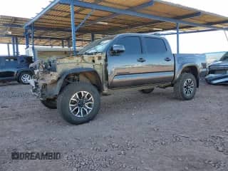 2020 Toyota Tacoma TRD Off Road with VIN 5TFCZ5AN0LX220213, listed as a Copart auction lot 82211705 with 72,977 mi miles and Salvage title. Bid and sale history available at DreamBid. Image 1.