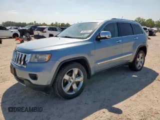 2012 Jeep Grand Cherokee Overland с VIN 1C4RJECT8CC277716, выставлен на аукционе Copart как лот 80339575 с пробегом 169 579 миль миль и Списание • Salvage title. История ставок и продаж доступна на DreamBid. Изображение 1.