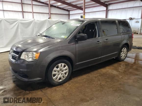 2018 Dodge Grand Caravan SE z VIN 2C4RDGBG5JR312871, wystawiony jako Copart lot #69593385 z przebiegiem 159 455 mil mil oraz Czysty tytuł • Clean title. Historia ofert i sprzedaży dostępna na DreamBid. Obrazek 1.