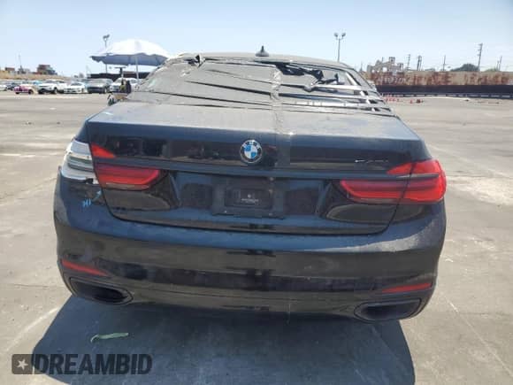 2017 BMW 7 Series 740i with VIN WBA7E2C36HG740606, listed as a Copart auction lot 65196225 with 84,940 mi miles and Salvage title. Bid and sale history available at DreamBid. Image 6.